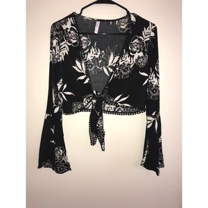 • Black and white long sleeved, floral print top •